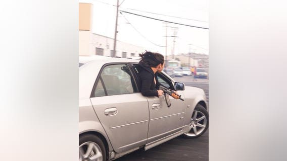 Passenger leaning out of car wields AK-47 at illegal San Francisco event