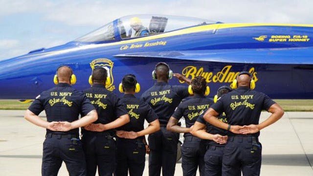 Police star worn by fallen Police Officer Ella French carried by Blue Angels in flight above Chicago