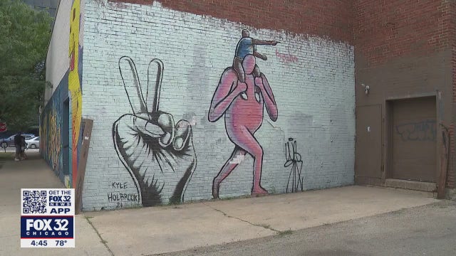 Artist creates mural in Logan Square to promote peace