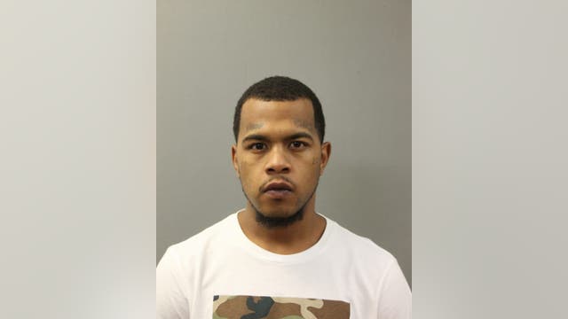 Parolee charged with killing man who was riding in a van with his girlfriend, daughter when he was shot