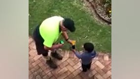 Sanitation worker, boy trade gifts in mutual acts of kindness