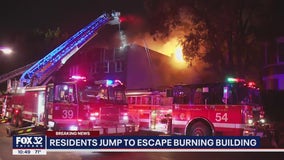 People jump to safety as crews battle apartment building fire on Chicago's South Side