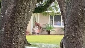 UPS driver in Texas puts packages in plastic bags to protect from Nicholas' rain