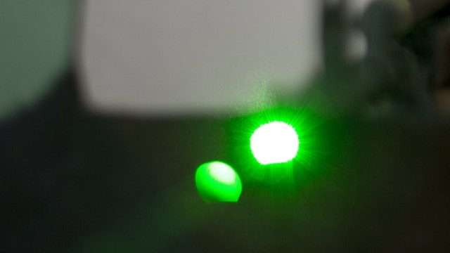 Men using gun equipped with green laser have robbed four people in Chicago