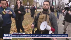 Man with AR-15 style rifle among protesters who gathered outside Kyle Rittenhouse trial