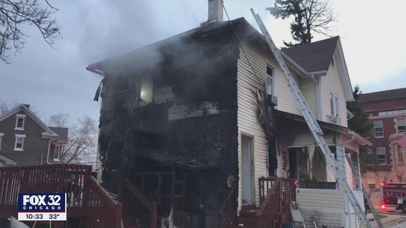 Police grabbed a ladder from a backyard and rescued five people from a burning home in Aurora