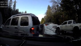 Video shows SUV plow into Oregon police car after sliding on black ice
