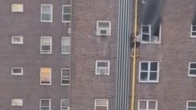 DRAMATIC VIDEO:  2 teens crawl down building to escape deadly fire