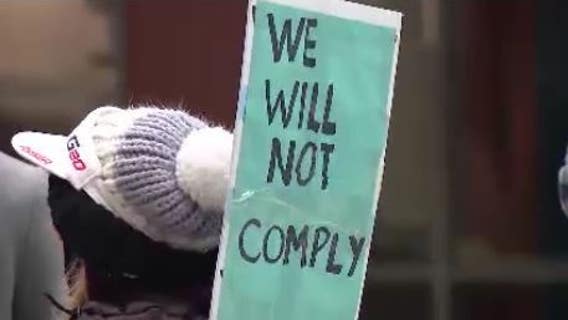 Protest outside Chicago City Hall against vaccine mandate for entering bars, restaurants
