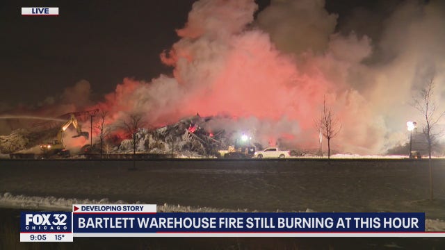 Massive warehouse fire in Bartlett continues to burn for second day
