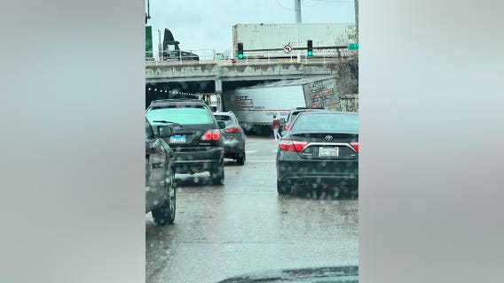 Truck stuck under viaduct on Chicago's South Side