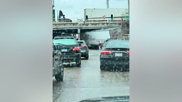 Truck stuck under viaduct on Chicago's South Side