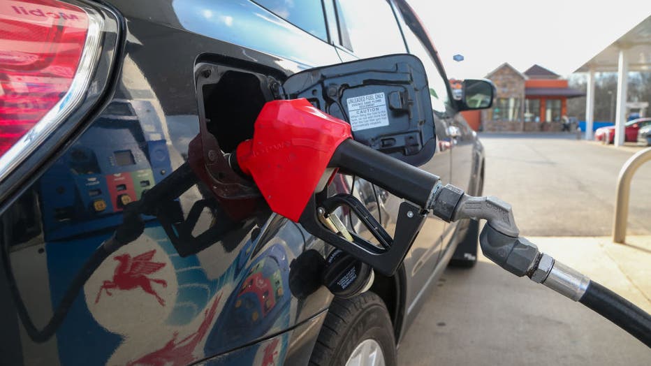 A car is seen filling up at a gas pump at a Mobil station.