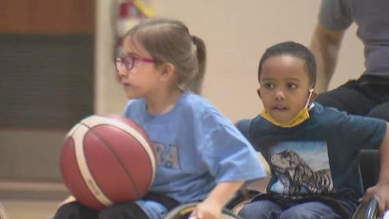 Kids learning new skills, drills at traveling wheelchair basketball clinics in Chicago suburbs