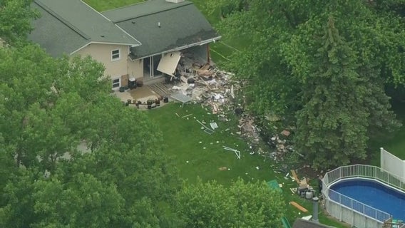 Vehicle crashes through Downers Grove home; minor injuries reported