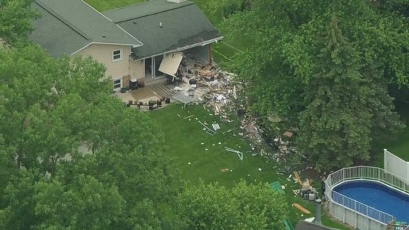 Vehicle crashes through Downers Grove home; minor injuries reported