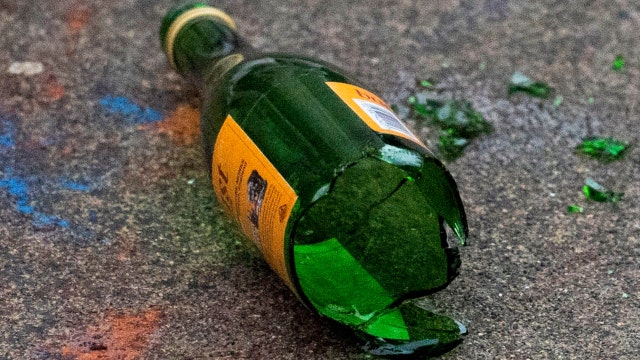 Woman bashes man over head with bottle, stabs him in SWAT incident