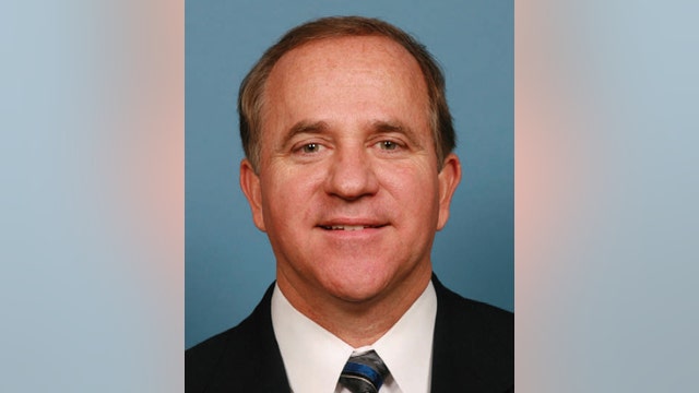 Former Indiana congressman among 9 charged in insider trading cases