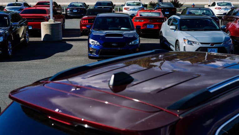 Coverage and portraits at Autolenders location on a story about the used car market.