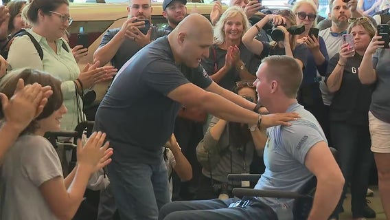 Chicago Police Officer Danny Golden escorted home after shooting paralyzed him last month