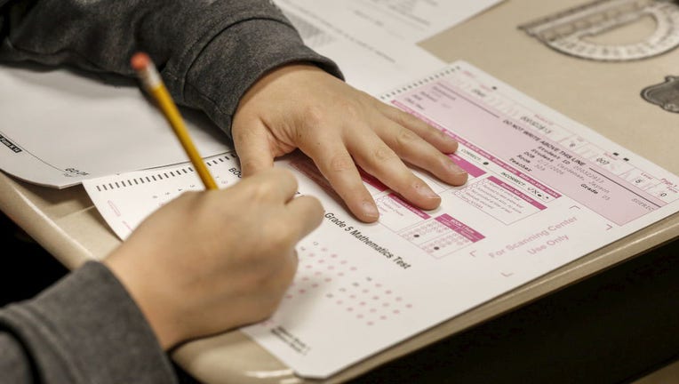 Student takes math test on Long Island