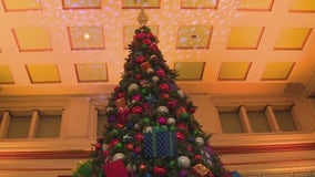 Macy's puts finishing touches on Christmas tree inside Walnut Room