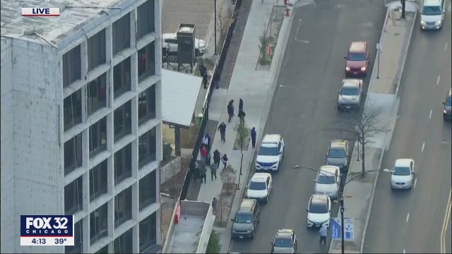 Man, woman found shot to death in car on Chicago's West Side; cop injured controlling crowd at the scene