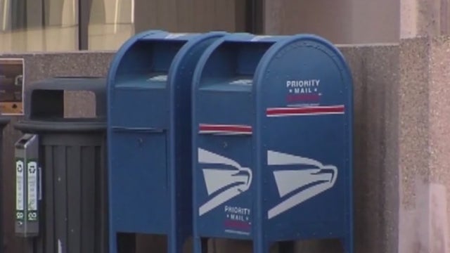 Postal worker caught on camera using proceeds of mail stolen from suburban post office