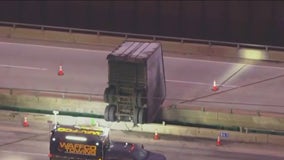 UPS truck left dangling off bridge on Indiana Toll Road after bizarre crash