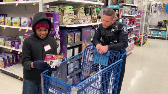 Boy who was saved from icy retention pond among participants at Aurora's Shop with a Cop