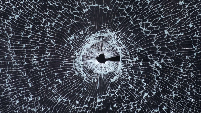 Bullet breaks through window of South Side home critically wounding man