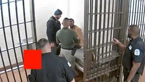 'Appalling' video shows Chicago police officer repeatedly punching man in holding cell
