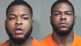 2 men arrested in connection to armed robbery in parking lot of suburban pizza place