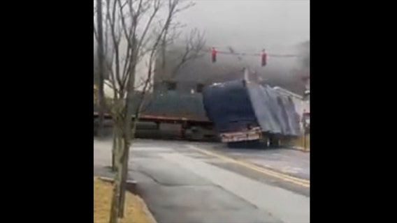 Video: Train slams into truck in NY