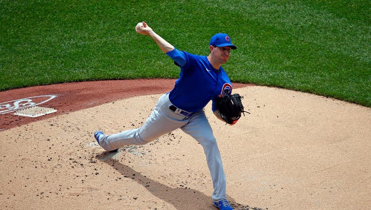 Chicago Cubs starting pitcher Kyle Hendricks (28) throws in the