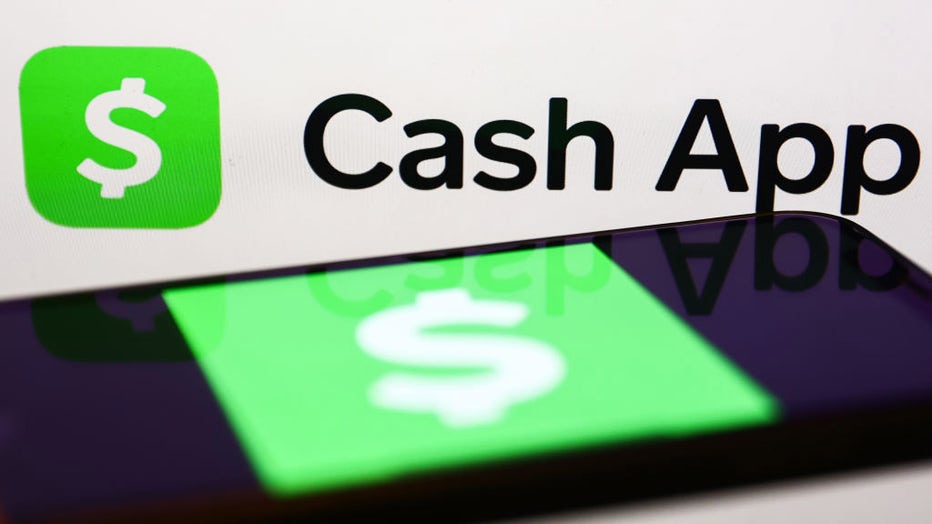 FILE IMAGE - The Cash App logo is seen on a laptop screen and the Cash App icon is seen on a phone screen. (Photo by Jakub Porzycki/NurPhoto via Getty Images)