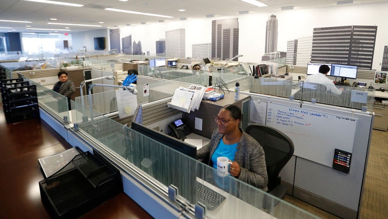 Workers-sit-in-their-cubicles.jpg