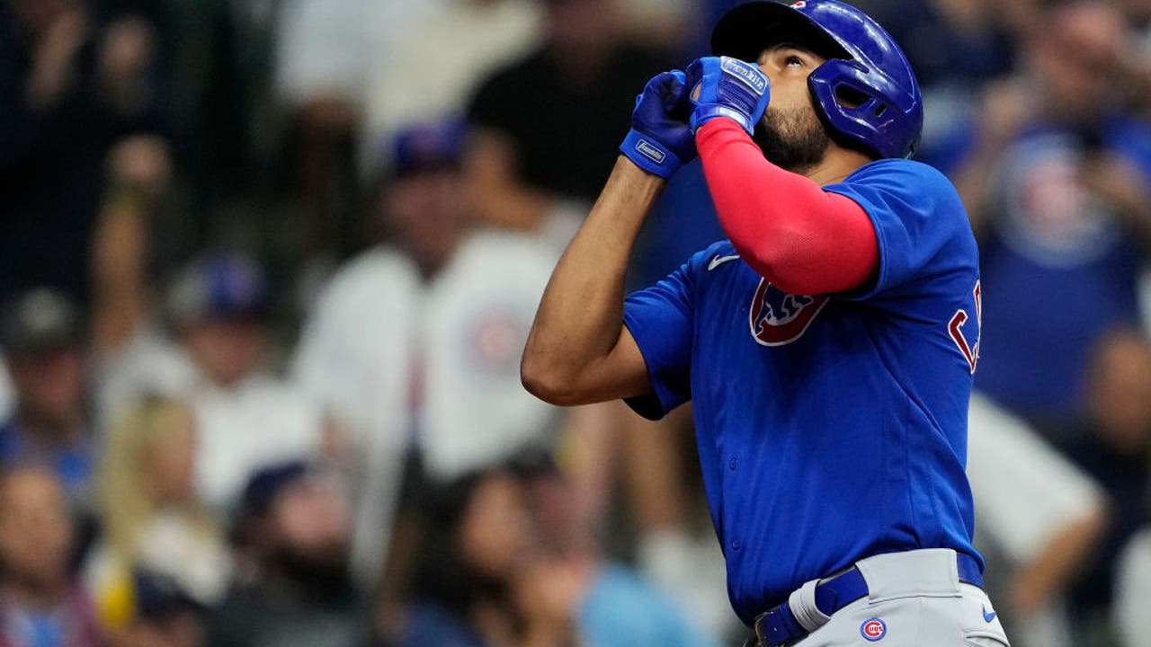 Happ's homers help Cubs defeat Brewers 4-3 in 10 innings