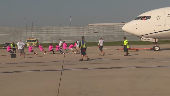 Teams compete to pull 48-ton plane at O'Hare Airport for Special Olympics