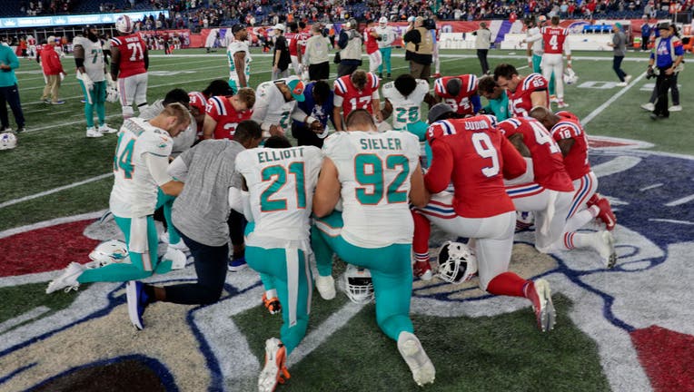 A New England Patriots fan screams during the game against the