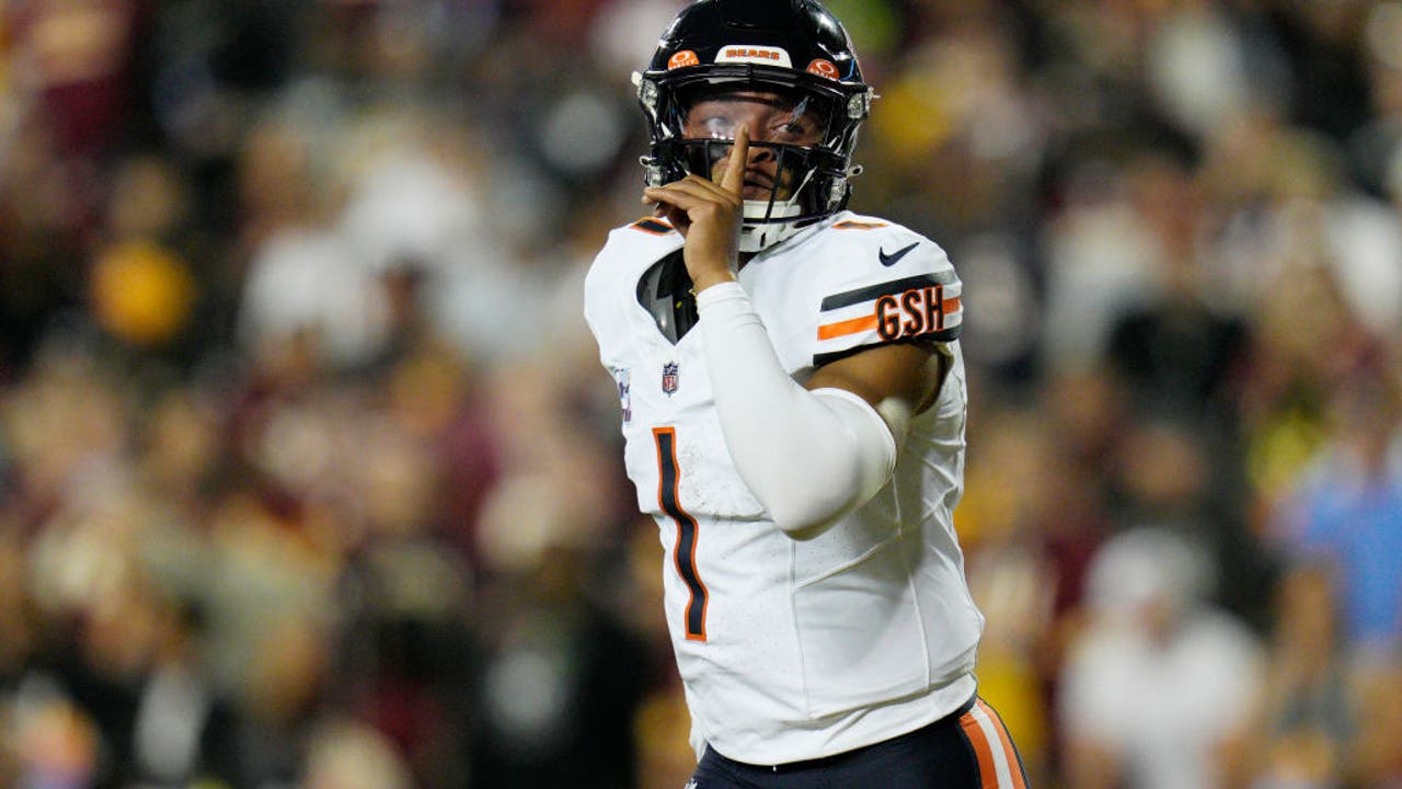 Khalil Herbert and DJ Moore of the Chicago Bears celebrate after a