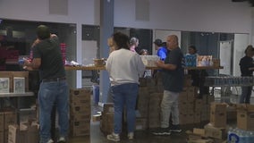 Chicago volunteers assemble kits for migrants as suburb begins vaccination clinics