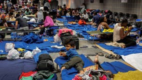 Hundreds of migrants live inside O'Hare Airport as Chicago grapples with how to house them
