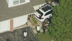 Car crashes into Cook County home, driver and passenger taken to hospital