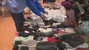 Saint Sabina community gives away over 1200 winter coats, hats, and gloves to those in need