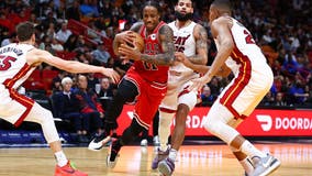 Bulls run out to huge lead, then hang on to beat Heat 124-116