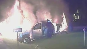 Fraser officer pulls woman from burning pickup truck