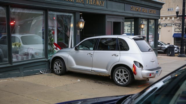 Car crashes into suburban store, shattering window: police