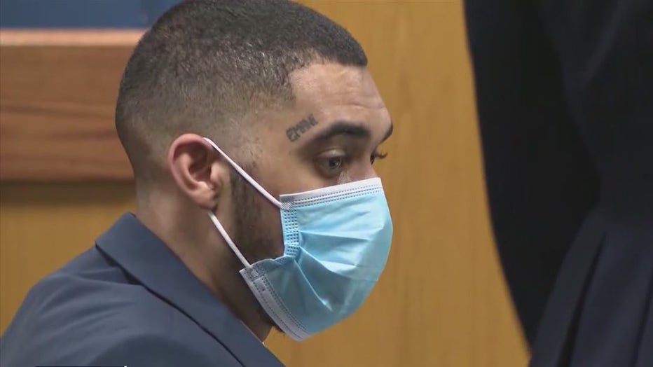 Daquan Reed sits in a Fulton County courtroom during his trial in the murder of 7-year-old Kennedy Maxie on August 18, 2022.