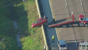 Vehicle crashes over I-355 wall near Addison; multiple southbound lanes shut down